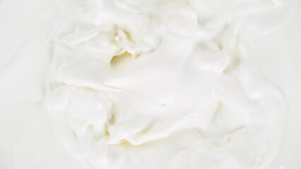 Obraz na płótnie Canvas Freeze motion of whirling milk cream, close-up