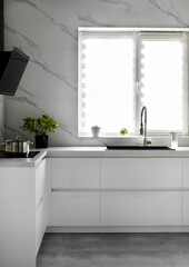 White scandinavian kitchen interior. A modern comfortable kitchen in a minimalist style. Interior design concept