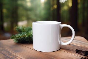 Empty blank mock up of white ceramic coffee mug with fir tree branch on a forest background
