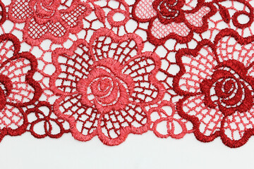 the macro shot of the embroidered textile lace