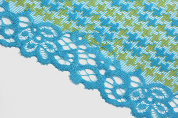 the macro shot of the embroidered textile lace