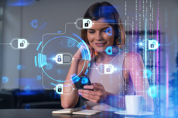 Smiling businesswoman in casual wear holding using smartphone typing at office workplace with notebook. Concept of distant work, business education. Blockchain crypto hologram