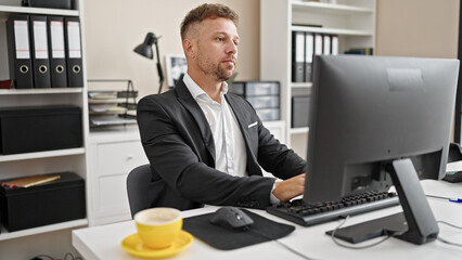Young man business worker using computer working at office