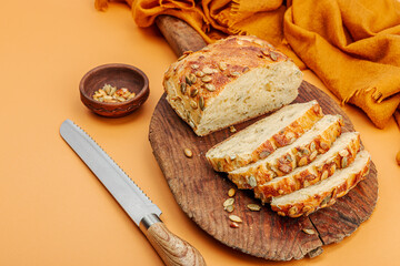 Fresh bread with pumpkin seeds. Home baking concept. Autumn decor
