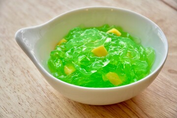 candied topping on dessert in little bow
