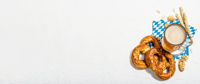 Traditional Oktoberfest set. Pretzels, beer, traditional pattern napkin. German festival food