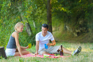 young man and woman at picnic