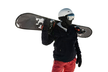 A male snowboarder in equipment and helmet, warm winter sports clothes, holds a snowboard in his...