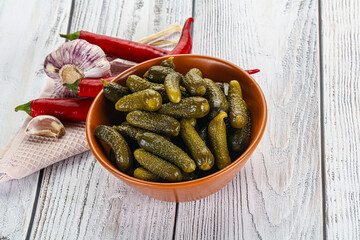 Marinated small cucumbers in the bowl