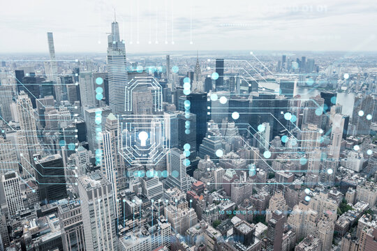 Aerial panoramic city view of Upper Manhattan area, the East Side, river and Brooklyn on horizon, New York city, USA The concept of cyber security to protect confidential information, padlock hologram