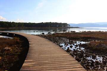 Fototapeta premium Wooden promenade and shallow sea near St. Nicholas Fortress in Sibenik, Croatia.