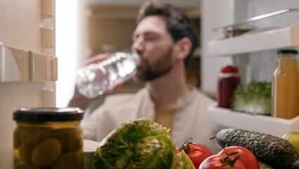 Point of view POV inside refrigerator Caucasian man male homeowner householder vegetarian guy open...