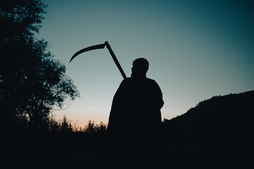 grim reaper, the death itself, scary horror shot of Grim Reaper holding scythe