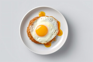 a fried egg on a toasted bread on a plate