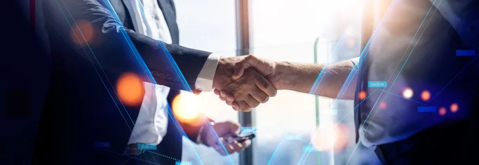 Foto op Plexiglas Businessman handshake for teamwork of business merger and acquisition,successful negotiate,hand shake,two businessman shake hand with partner to celebration partnership and business deal concept  © Yingyaipumi