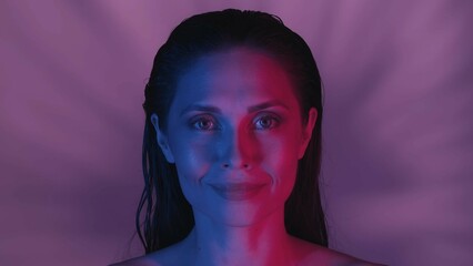 Close up shot of a seminude young woman's face. She is confidently looking at the camera in a joyful and satisfied way, neon pink and blue color scheme.