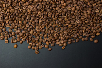 Coffee beans on black background with copy space