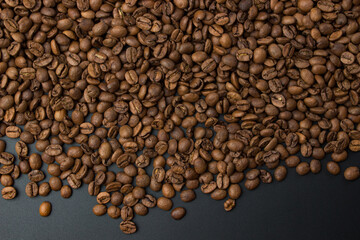 Coffee beans on black background with copy space