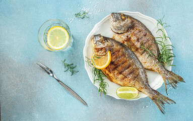 Grilled dorado fish and lemon. Healthy food. roasted dorado. Detox and clean diet concept. place for text, top view