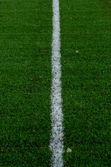 green artificial turf on an outdoor football field