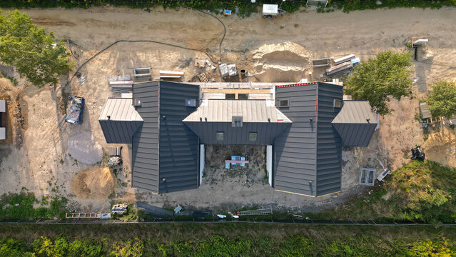 Newly constructed semi detached house for families: modern design, technology, and real estate market concept, aerial view.