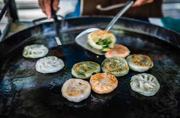 Pan-fried Kui Chai is a fried Chinese dish sold in a market in Yaowarat, Bangkok, Thailand.