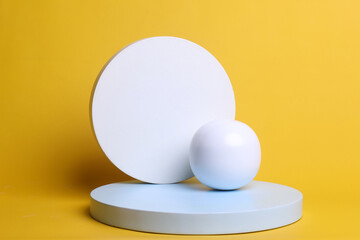 Composition of abstract geometric forms over yellow background for product display and presentation