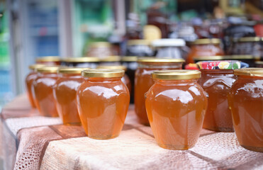Preparations for winter of juice and compote at home. Preservation of apple compote in jars on table