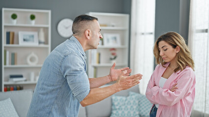Fototapeta premium Man and woman couple arguing at home