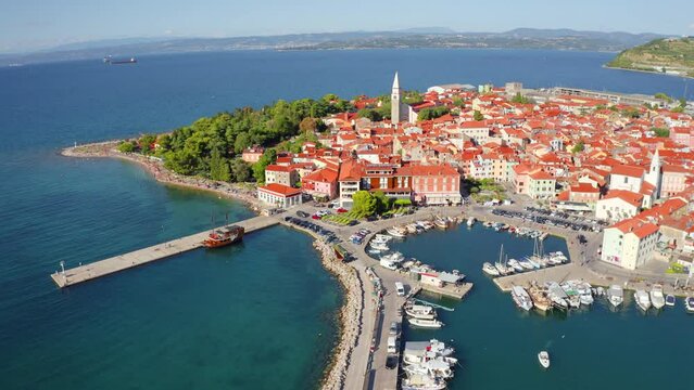 4k drone forward video (Ultra High Definition) of Izola town, Slovenia. Superb morning seascape of Adriatic sea. View from flying drone of old sea port. Traveling concept background.