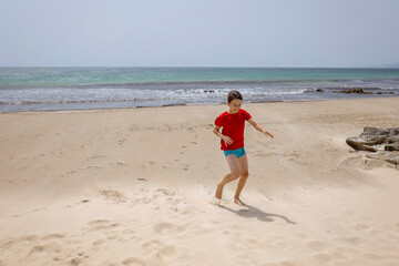 Family with children, visiting the most south point of Europe, Tarifa in Spain