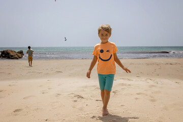 Family with children, visiting the most south point of Europe, Tarifa in Spain
