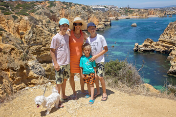 Children, enjoying Benagil, Portugal. Benagil Cave inside Algar de Benagil, famous sea cave in...