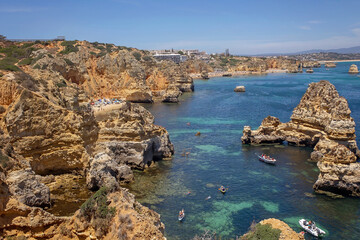 Children, enjoying Benagil, Portugal. Benagil Cave inside Algar de Benagil, famous sea cave in Algarve coast, Lagoa.