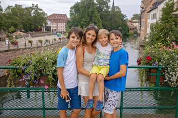 Beautiful family with children, boys, visiting Strasbourg during summer vacation