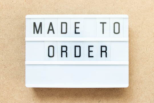 Lightbox with word made to order on wood background