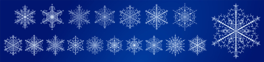 Set of several beautiful complex Christmas snowflakes, white on blue background