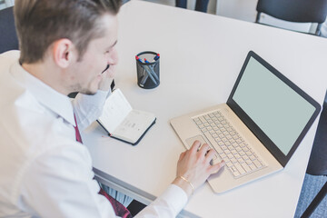 Young businessman using pc