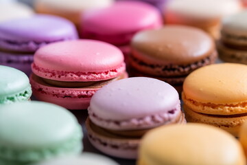 Obraz premium Close up colorful macarons dessert with vintage pastel tones