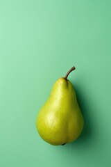 Isolated one whole green pear on green background.