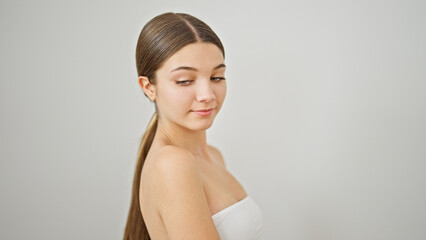 Obraz premium Young beautiful girl standing with relaxed expression looking to the side over isolated white background