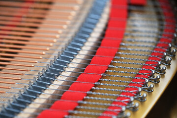 close up strings inside piano. String in classical instrument - Powered by Adobe