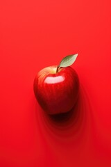 One isolated whole red apple on red background.