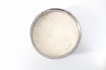 Selective focused image of fermented batter for idli and dosa in an isolated background. Idly and dosa batter in a bowl for fermentation, used to prepare the dosa and idli..