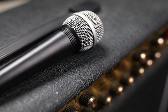 Wireless microphone on a black guitar amplifier, amp, closeup. 