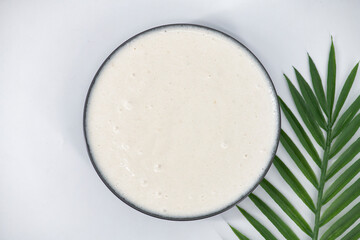 Selective focused image of fermented batter for idli and dosa in an isolated background. Idly and dosa batter in a bowl for fermentation, used to prepare the dosa and idli..