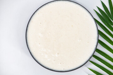 Selective focused image of fermented batter for idli and dosa in an isolated background. Idly and dosa batter in a bowl for fermentation, used to prepare the dosa and idli..