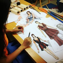 Fashion designer drawing and designing fashion dress 