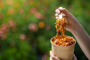 Chinese takeaway food. Wok with noodles, vegetables and meat.