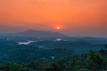 Fototapeta na wymiar Kerala tourist place image, tropical sunset view from Wayanad, Mountain landscape with beautiful river view
